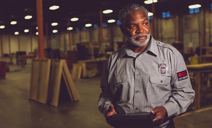 Industrial Photography - Portrait of Security guard checking factory warehouse