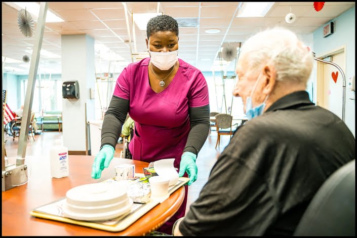 Michael LoBiondo Healthcare Photography Portfolio - Veterans Affairs food service technician serving food