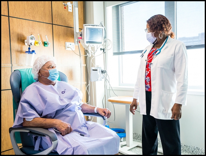 Michael LoBiondo Healthcare Photography Portfolio - Veterans Affairs doctor talking to patient in treatment room