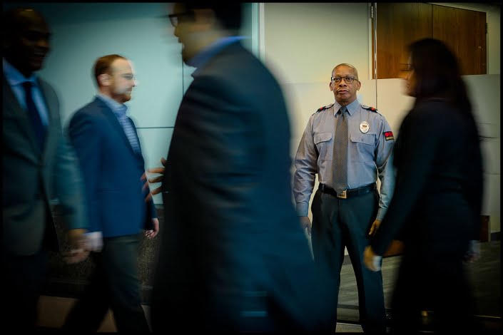 Michael LoBiondo Photography - Security watching people walking in lobby
