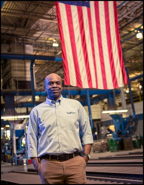 Michael LoBiondo Photography - Shift supervisor standing in front of American Flag on production floor