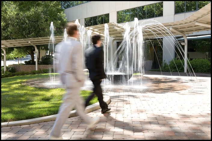 Michael LoBiondo Photography - Men walking in front of fountain at building entrance
