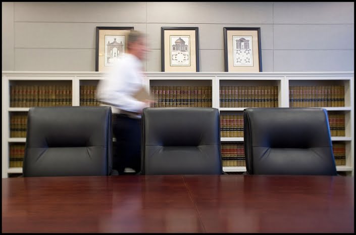 Michael LoBiondo Photography - Legal assistant walking in conference room with shelves of books