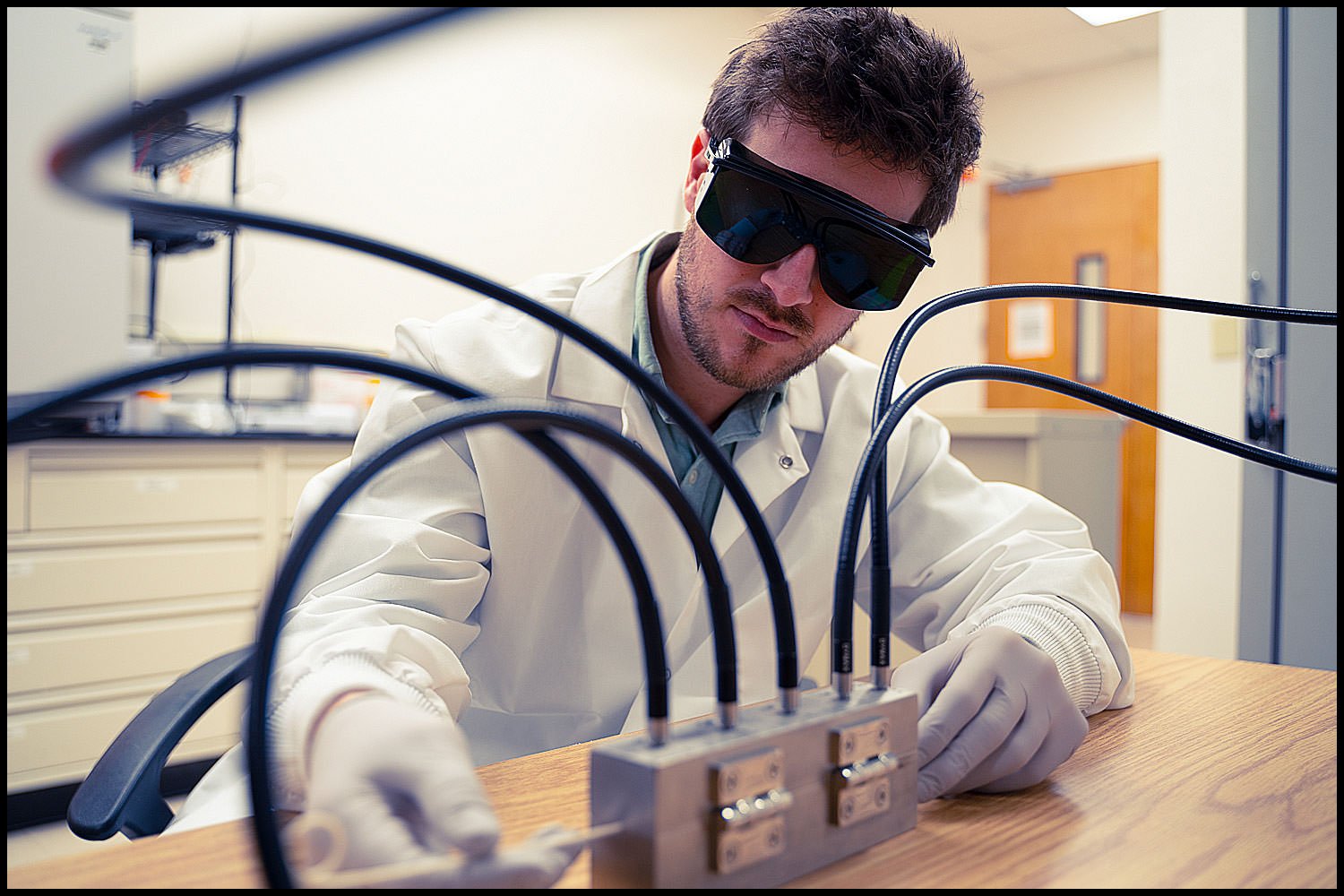MIchael LoBiondo Photography - Lab technician with dark safety glasses in testing area