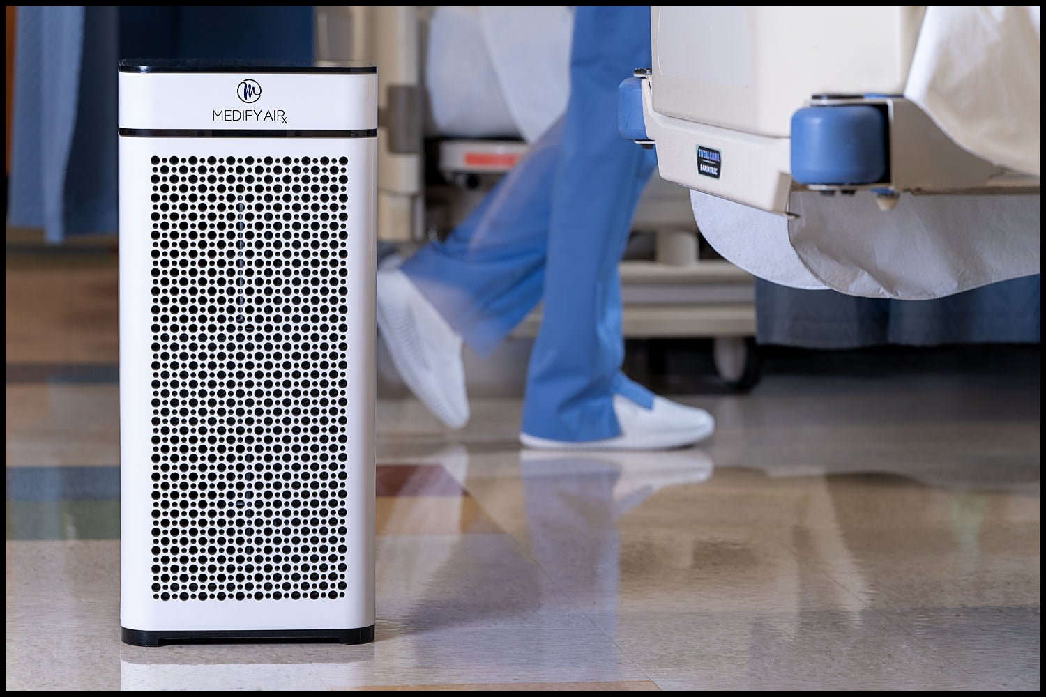 product-safety-air-handler-medical-healthcare Michael LoBiondo Photography - nurse walking behind air handler in hospital room