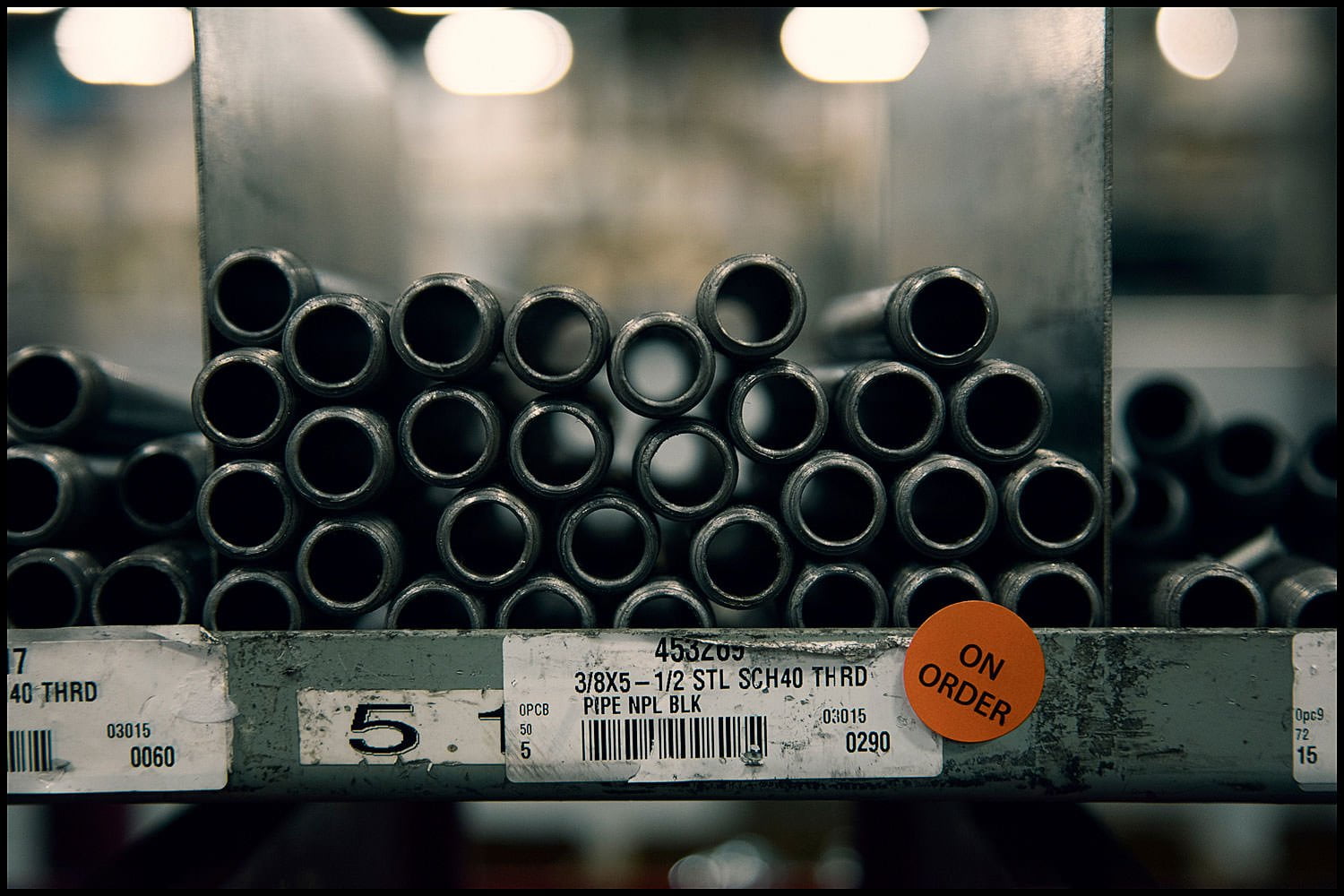 Michael LoBiondo Photography - steel pipe on shelf