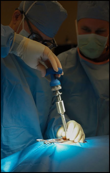 Michael LoBiondo Photography - doctors performing spine surgery using device