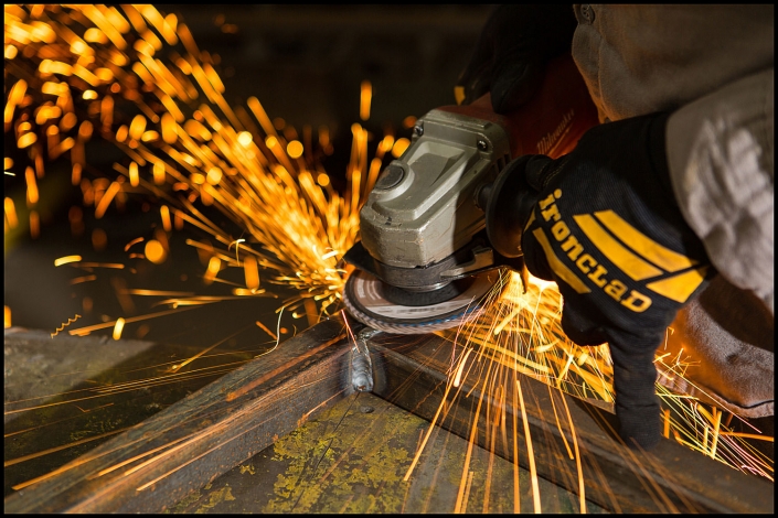 Michael LoBiondo Photography - workers hands operating grinder with sparks