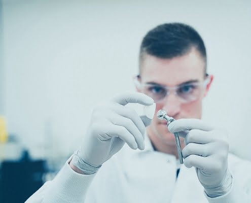 product-healthcare-plastics-polymer-joint Michael LoBiondo Photography - 3d printed ball being fitted in metal joint