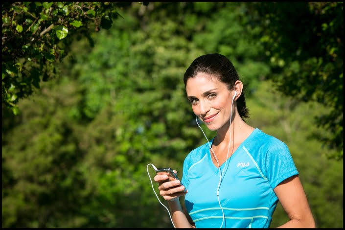 Michael LoBiondo Photography - Female runner pausing while listening with headphones