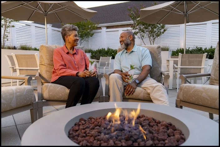lifestyle-retirement-firepit Michael LoBiondo Photography - Retired couple having an early evening drink by the fire