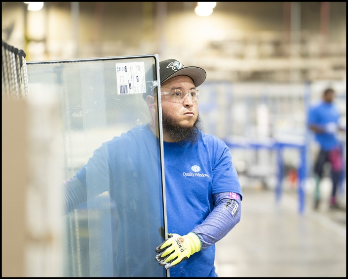 Michael LoBiondo Photography - worker moving glass for installation - shot by professional industrial photographer Michael LoBiondo