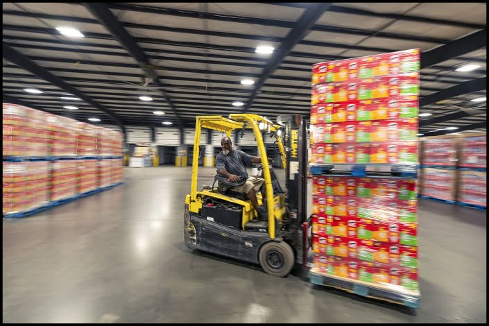 Michael LoBiondo Photography - forklift operator moving product in warehouse - shot by professional industrial photographer Michael LoBiondo