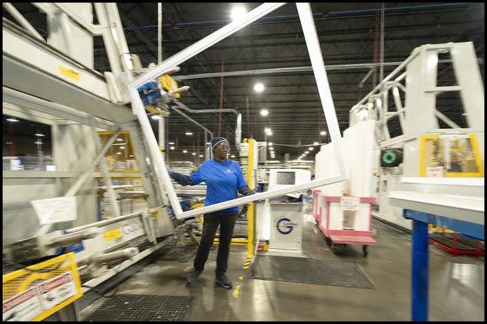 Michael LoBiondo Photography - operator moving glass frame in manufacturing of windows - shot by professional industrial photographer Michael LoBiondo