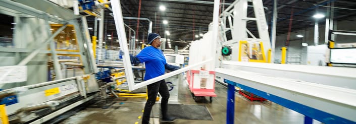 lobiondo-industrial-manufacturing-glass-windows Manufacturing worker assembling window frames on an industrial production line