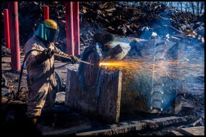lobiondo-industrial-recycling-location Michael LoBiondo Photography- torch worker separating metals in recycling yard.