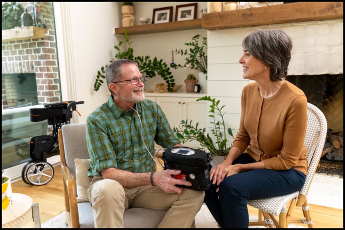 Healthcare professional consulting with patient in home setting