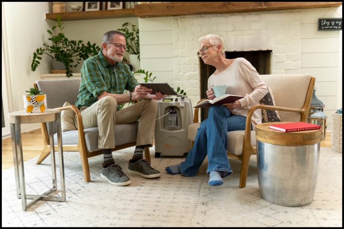 Senior patient meeting with healthcare professional in home environment
