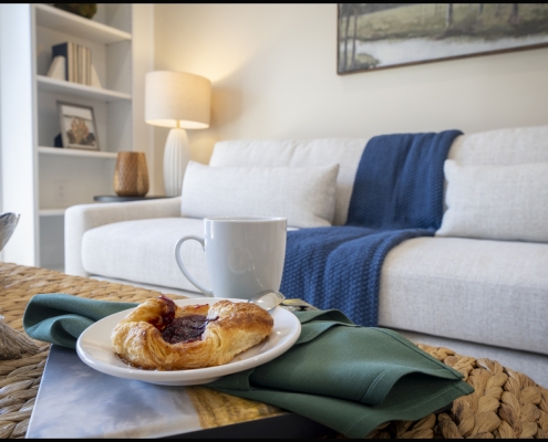 Healthcare lifestyle photography showing a furnished apartment with coffee and breakfast in a comfortable residential living space.