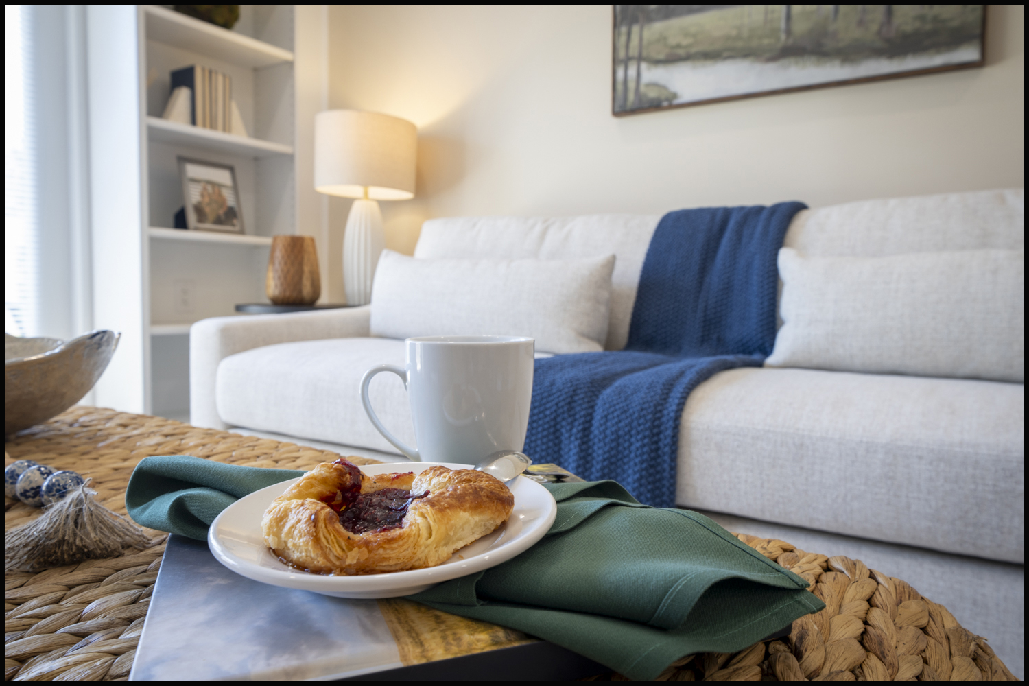 Healthcare lifestyle photography showing a furnished apartment with coffee and breakfast in a comfortable residential living space.